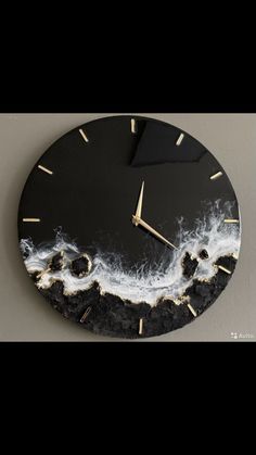 a clock that is on the wall with water and clouds painted on it's face