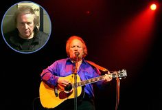 a man that is playing a guitar in front of a microphone and an image of him