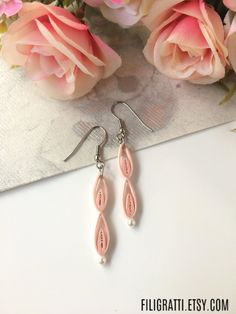 If minimalist jewelry is your style, then you will definitely love these simple long earrings in a pretty pink colour. Click through to check them out on etsy. These light pink earrings also make for amazing bridesmaid gifts. #minimalistjewelry #longearrings #simpleearrings #pinkearrings #etsy Paper Quilling Jewelry, Great Anniversary Gifts, Quilling Jewelry, 1st Anniversary Gifts, 21st Birthday Gifts, Paper Jewelry, Pink Earrings, Simple Earrings, Earrings Collection