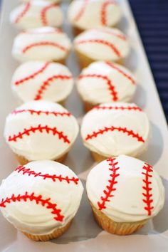 cupcakes with red and white frosting are on a tray in front of an instagram page