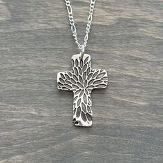 A hand stamped 99.9% fine silver cross pendant on a sterling silver box chain. Cross Measurement: 1-1/8 inches long Chain is 18 inch long Silver Cross Pendant, Kraft Gift Boxes, Silver Box, Long Chain, Silver Cross, Box Chain, Fine Silver, Cross Pendant, Hand Stamped