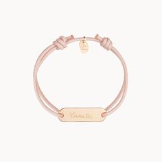 A timeless gift of love for your little one's special day, our Personalized Mini Identity Bracelet is the perfect keepsake to create for a Christening or Communion. Adjustable to fit comfortably on tiny wrists, each bracelet can be personalized with a braid of their favorite color, and a hand-engraved name and special date to match.18K Champagne Gold Plated or 925 Sterling SilverIdentity charm: 0,5 x 0,2Braid made of a durable, colorfast polyesterFully adjustable sliding knot fasteningHand-engra Adjustable Sliding Knot, Sliding Knot, Timeless Gifts, Champagne Gold, Hand Engraving, Christening, Personalized Jewelry, Favorite Color, Special Day