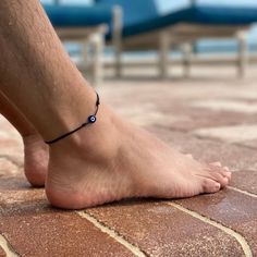 Protect your energy and enhance your style with our Evil Eye Anklet. This adjustable, waterproof ankle bracelet features a lucky eye charm, making it perfect for women, men, and teens. Crafted with a durable cord, it’s ideal for the beach, surfing, or any outdoor activity. The unisex design ensures it's a versatile accessory for anyone. Enjoy both protection and fashion with this anklet, perfect for everyday wear and summer adventures. Minimalist Adjustable Anklets For Beach, Minimalist Adjustable Beach Anklets, Adjustable Evil Eye Friendship Bracelets For The Beach, Adjustable Evil Eye Bracelet Summer Gift, Adjustable Evil Eye Anklets As Gift, Adjustable Evil Eye Bracelet For Summer, Evil Eye Anklet, Protect Your Energy, Beach Surfing