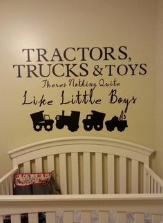 a baby's room with a crib and wall decal that says tractors, trucks & toys there is nothing quite like like little boys