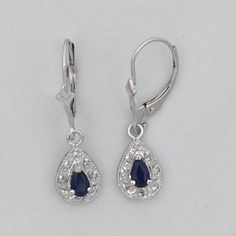 "SOLID 14KT WHITE GOLD EARRINGS NATURAL SAPPHIRE IS 5x3 mm PEAR SHAPE (0.60 TCW) NATURAL DIAMOND IS 0.10 TCW EARRING LENGTH IS 1\" INCH COMES IN GIFT BOX" Classic Sterling Silver Jewelry For Pierced Ears, Formal Pear-shaped White Gold Earrings, Formal White Gold Pear-shaped Earrings, Classic White Gold Teardrop Earrings With Prong Setting, Classic Sterling Silver Earrings With Polished Finish, Elegant Drop Earrings With Diamond Cut, Classic White Gold Teardrop Diamond Earrings, Formal Sapphire Dangle Diamond Earrings, Teardrop Diamond Accents Fine Jewelry