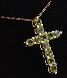 1.20 Carat Natural Green Peridot 14K Solid Yellow Gold Cross Pendant with Chain Amazing looking piece! Suggested Replacement Value: Approx. $1600.00 Total Natural Round Cut Green Peridots Weight: 1.20 Carat Chain Length is: 16 inches Pendant measures: Approx. 25 x 18.4mm Total item weight is: Approx. 2.1g Disclaimer: all weights, measurements and colors are approximate and may vary slightly from the listed dimensions or as seen in the image. All pictures are magnified to show the smallest of det Luxury Yellow Gold Peridot Jewelry, Luxury Peridot Jewelry For Gifts, Luxury Peridot Multi-stone Jewelry, Luxury Multi-stone Peridot Jewelry, Fine Jewelry Peridot Necklace For Anniversary, Luxury Peridot Jewelry For Formal Occasions, Formal Fine Jewelry With Peridot, Luxury Gold Jewelry With Peridot, Luxury Gold Peridot Jewelry