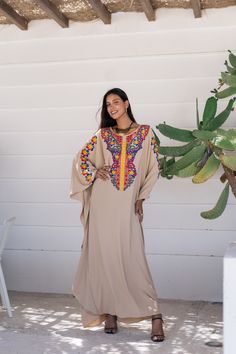 *Note : The kaftan in the video is a different color and is only displayed to show the fit, flow, and cut of the Kaftan. You will receive the one in the pictures.* A bohemian flash caftan made of light mesh of linen and poly, the fabric is unique in that it's very flowy and not the usual feel and touch of linen. This Kaftan is ideal to wear for any casual occasion. Whether taking a trip down the shopping lane, or home-based kitty parties, or about anything else, wearing this dress will make you Festive Bohemian Kaftan With Dabka Detailing, Festive Bohemian Kaftan With Dabka, Festive Beige Kaftan With Resham Embroidery, Festive Kaftan With Embroidered Border, Floor-length Resham Embroidered Kaftan, Bohemian Beige Kurta For Festive Occasion, Bohemian Kaftan With Resham Embroidery For Festivals, Festival Kaftan With Dabka Detailing, Bohemian Beige Kurta For Eid