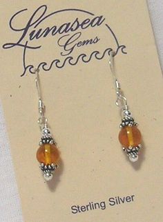 BY LUNASEA TREASURES of NEW ENGLAND,  AMBER & STERLING SILVER BEADED DANGLE EARRINGS.   GENUINE GOLDEN YELLOW AMBER 6mm ROUND BEAD IS SANDWICHED BETWEEN PRETTY STERLING SILVER CAPS & BALLS.  EARRINGS MEASURE 3/4" FROM FRENCH EAR WIRES.  SAFETY BACKS ARE INCLUDED.  ALL FINDINGS ARE STERLING SILVER.  BE SURE TO CHECK OUT MY OTHER JEWELRY I HAVE LISTED. Froo www.froo.com | Froo Cross Sell, Free Cross Sell, Cross promote, eBay Marketing, eBay listing Apps, eBay Apps, eBay Application Amber Dangle Earrings, Handmade Wire Earrings, Boho Earrings Diy, Diy Earrings Tutorial, Wire Earrings Handmade, Handmade Bead Jewellery, Beaded Jewelry Earrings, Popular Earrings, Unique Handmade Earrings