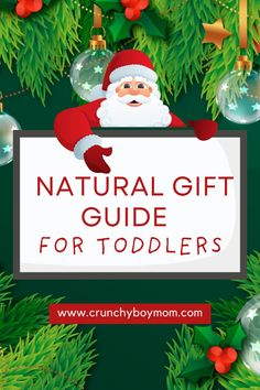 a santa clause holding a sign that says natural gift guide for toddlers on it