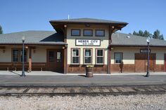 the train station is empty and ready for passengers to board it's next door