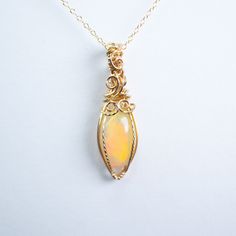 Fire Opal pendant wire wrapped by hand in 14K GOLD filled. Comes with 14K GOLD filled chain 18 inches. Rainbow Opal, Opal Pendants, Opal Necklace, Gold Filled Chain, Fire Opal, Wire Wrapped, Wire Wrapping, Gold Chains, Gold Filled