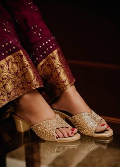 Golden Hand Embroidered Heels With Double Cushion soles . They are handmade with double cushion soles. Heel : 2 inches Shrivas By Archita is a designer label where every product is handcrafted by team of designers and workers. We welcome any customization. Say hi at shrivasbyarchitaseo@gmail.com. Luxury Gold Wedding Shoes For Reception, Traditional Luxury Gold Heels, Luxury Traditional Open Toe Heels, Luxury Round Toe Dress Shoes With Tassels, Heels Indian Wedding, Luxury Yellow Gold Filigree Brooches, Wedding Footwear For Bride Indian, Footwear For Bride Indian, Traditional Footwear Women