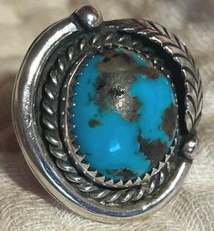 Vintage "Bisbee blue" turquoise and silver ring, size 7 1/4" . Moderately domed stone shows golden matrix. The high blue is especially intense; this shade of blue is found in both Bisbee and in Persian turquoise. Split shank. Unmarked, as was traditional prior to the 1980s. 10 grams. Please don't hesitate to ask any questions. Persian Turquoise, Vintage Turquoise, Turquoise Blue, Shades Of Blue, Rings Statement, Statement Rings, Ring Size, Jewelry Rings, Silver Rings