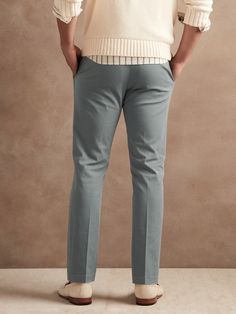 A sophisticated spin on our best-selling chinos, this tapered cotton pant has a pleated front and soft center crease at back so it's simple to fold and looks tailored when worn.  ATHLETIC TAPERED FIT: Not just for athletes, this fit is designed to de Fitted Solid Color Chinos With Welt Pockets, Fitted Chinos With 5-inch Inseam, Tailored Cotton Dress Pants With Tapered Leg, Stretch Cotton Chinos For Formal Occasions, Formal Stretch Cotton Chinos, Casual Cotton Pants With Pressed Crease, Cotton Chinos With Pressed Crease, Relaxed Fit Tapered Leg Chino Dress Pants, Solid Tapered Leg Chinos For Business Casual