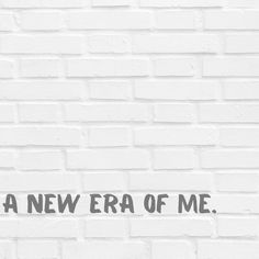 a white brick wall with the words i'm a new era of me on it