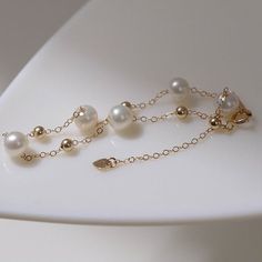 Carefully selected 6-7 Aurora freshwater pearls sparkle like light bulbs, have a classic beauty and add brilliance to the neck. Made from a 14K cast gold chain, this necklace is durable and has 14K gold certification. Simplicity and subtlety are key, no need for fancy beading or extra playfulness for a soft touch. Wear alone or layered for a trendy and versatile look Metal: 14K Gold Filled Gemstone: Freshwater Pearls Pearl Diameter: 6-7mm Length: 14-18mm Weight: 1.7g Edison Pearls, Chain Bracelets, Tiger Eye Stone, Pearl Chain, Classic Beauty, Stardust, Pearl Bracelet, Stone Necklace, Ring Bracelet