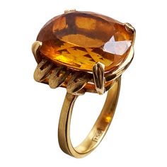 This classic 18K gold ring masterfully displays a magnificent Imperial Citrine quartz crafted in the shape of a large 06.2" x 0.5" x 0.3", weighing 6.5 grams. Size 6, ring size 1" h by 0.75" w by 0.50 " d The stone is set in a center prong style for eye-catching brilliance. This exquisite piece of jewelry is an ideal addition to any fine jewelry collection and provides excellent style and luxury. Citrine is more than just a beautiful gemstone; it carries a wealth of symbolism and cultural signif Gold Oval Crystal Ring For Formal Occasions, Formal Faceted Emerald Ring, Luxury Amber Rings For Formal Occasions, Faceted Emerald Ring For Formal Occasions, Oval Citrine Jewelry For Formal Occasions, Gold Faceted Crystal Ring For Formal Occasions, Faceted Emerald Ring Fine Jewelry For Formal Occasions, Gold Gemstone Signet Ring For Formal Occasions, Yellow Gold Crystal Gemstone Ring For Formal Occasions