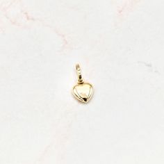 Crafted in 14k yellow gold, this single mini puffed heart pendant shines and is perfect for every gift-giving occasion. The chain pictured is for illustration purposes only and may be purchased separately. 14k ﻿hollow yellow gold 8mm tall excluding bail x 8mm wide Chain is not included Product color may differ due to lighting Puffed Heart, Mini Heart, Heart Pendant, Belly Button Rings, Yellow Gold, Stud Earrings, Chain, Lighting, Yellow