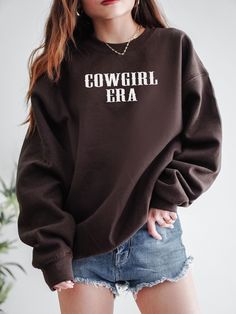 Express your Inner Cowgirl with this cute Cowgirl Era Sweatshirt! This unique cowgirl crewneck is super comfy! Size up for a Trendy Oversized Look! ♥ Hello and Welcome to Meaningful Tees Shop! ♥ Printed on the most popular Unisex Sweatshirt, the Gildan 18000 is 50% Cotton / 50% Poly. The soft fleece lining makes it super Comfy and is sure to become your new favorite! ♥ All of our items are made to order with care for each customer : ) ♥ Please allow 3-7 BUSINESS days (usually 3-5) for your item to be created PLUS shipping time via USPS ♥ This Unisex Sweatshirt fits like a Men's on Women, but is not overly large. ♥ For a RELAXED FIT, your usual size will typically work, but please consult the Size Chart in the Listing Photos ♥ For an OVERSIZED FIT, size up 1, 2, or 3 Sizes! (2 sizes up is t Casual Cow Print Tops For Fall, Casual Cow Print Crew Neck Top, Casual Crew Neck Cow Print Tops, Casual Cow Print Tops With Relaxed Fit, Casual Fall T-shirt With Cow Print, Casual Cow Print T-shirt For Fall, Cotton Crew Neck Top With Cow Print, Casual Long Sleeve Tops With Cow Print, Casual Long Sleeve Cow Print Top