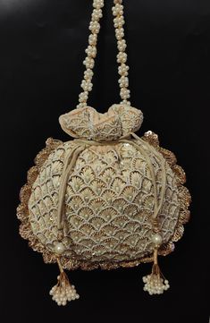 "beautiful thread embroider pearl bead evening bag woman beige designer handbag | bridesmaid wedding drawstring purse with beaded chain Package Contents: As per quantity purchased Size: 10\" x 8\" Designed with the heart, this beautiful Potli or batawa bag are eye catchy and made of premium material. Key Features: Embroidery art work This potli is good match with both Indian and western outfits and are superb for wedding and festive parties. This would be best complement to your designer saree, Indian Wedding Bridesmaids, Fancy Face Mask, Burn Orange, Drawstring Purse, Embroidered Handbag, Beaded Evening Bags, Potli Bags, Embroidered Wedding, Bridesmaid Wedding