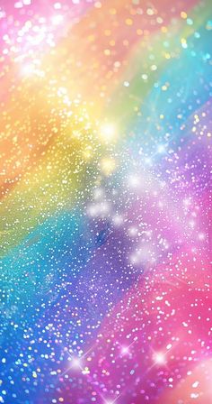 an abstract rainbow background with stars and sparkles