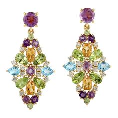 Cast from 14K gold, these multi gemstone earrings are true stunners. It is hand set with 1.9 carat amethyst, .85 citrine, .80 peridot, .80 carats topaz and .36 carats of diamonds. FOLLOW MEGHNA JEWELS storefront to view the latest collection & exclusive pieces. Meghna Jewels is proudly rated as a Top Seller on 1stDibs with 5 star customer reviews. All items manufactured by us are handmade and can be customized or redesigned. Composition Size-32X16 MM Total Weight-7.69 Gold Weight(Gms)-6.508 Diam Treasure Jewelry, Alexis Bittar Jewelry, Gem Diamonds, Gold Diamond Jewelry, Expensive Jewelry, Fabulous Jewelry, Diamond Gold, Top Seller, Gemstone Earrings