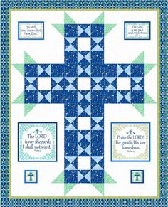 a blue and green quilt with the words, i am god for all that is love