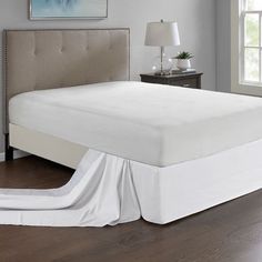 the bed is made and ready for someone to use it in their home or office