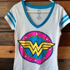 White Tee With Wonder Woman Emblem And Aqua Accents New Without Tags Women's Size Large 11/13 Multicolor Screen Print Tops For Fan Merchandise, Cotton Tops For Comic-con Fan Merchandise, Casual T-shirt For Comic-con, Cotton Top For Comic-con Fan Merchandise, Casual Tops For Comic-con, Pop Culture Tops For Comic-con And Fan Conventions, Casual Graphic Print Tops For Comic-con, Casual Tops With Graphic Print For Comic-con, Casual Comic-con Graphic Print Top