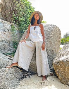 "Wide Leg Pants, White Summer Pants, Boho Pants Beautiful flare pants made with very soft double gauze cotton with stripe pattern Sizing: Made in one size to fit XS to XL / US: 2/4/6/8/10/12/14/16 Measurement; Elastic waist 23\"- 48\" Hip max 50\" Rise 11.5\" Length outseam 36\" Length inseam 24\" **Model is a size US 6. 5'4\" Tall** Description: Made with 100% soft double gauze cotton. The fabric is super soft and has a black stripe pattern. Medium-thick, breathable, and not a see-through. Elas Summer Vacation Harem Pants Ankle-length, Summer Vacation Wide-leg Harem Pants, Baggy Summer Vacation Pants, Baggy Straight Pants For Vacation, Summer Vacation Baggy Pants, Baggy Beach Bottoms For Beach Season, Summer Beach Pants With Baggy Fit, Baggy Wide Leg Pants For Beach, Baggy Summer Vacation Bottoms