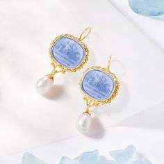 Ross-Simons - Italian 8-8.5mm Cultured Pearl, Blue Venetian Glass Cameo-Style Drop Earrings Over. Boasting a soft color palette in decorative bezels, an ornate cameo-style scene is depicted in two 18x15mm blue Venetian glass ovals. Made in Italy, our 18kt yellow gold over sterling silver drop earrings exemplify ancient style and timeless craftsmanship. For a luxe finishing touch, a lush 8-8.5mm cultured freshwater pearl drops from the design. Hanging length is 1 7/8". Earwire, blue Venetian glas Elegant Light Blue Gemstone Earrings, Classic Intaglio Earrings As A Gift, Blue High Luster Earrings For Formal Occasions, Formal Blue High Luster Earrings, Classic Intaglio Earrings For Formal Occasions, Classic Intaglio Earrings For Formal Events, Elegant Sapphire Jewelry With Cabochon, Elegant Evening Jewelry With Cameo Detail, Elegant Round Cameo Earrings