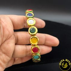 Manika Navratan Bracelet - Bangle -Bangle, Bracelet, Diva Exclusive, moissanite - Divahive Colorful Adjustable Spiritual Jewelry, Festive Fusion Metal Bracelets, Festival Fusion Bangle Jewelry, Elegant Multicolor Festive Bracelets, Festive Multicolor Gemstone Bracelets, Adjustable Multicolor Fusion Bracelets, Adjustable Multicolor Fusion Bracelet, Adjustable Multicolor Spiritual Bangle, Adjustable Round Bracelets For Festivals