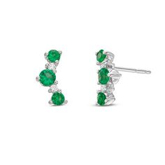 These delicate stud earrings feature emeralds totaling 0.56 carats and round brilliant cut diamonds totaling 0.05 carats. Fine Jewelry Green Diamond Earrings, Classic Green Diamond Earrings, Green Brilliant Cut Diamond Earrings, Emerald Earrings With Diamond Accents In Green, Green Diamond Earrings With Prong Setting, Green Diamond Earrings Fine Jewelry, Green Diamond Earrings In Fine Jewelry Style, Green Diamond Earrings With Diamond Accents, Green Round Earrings With Pave Setting