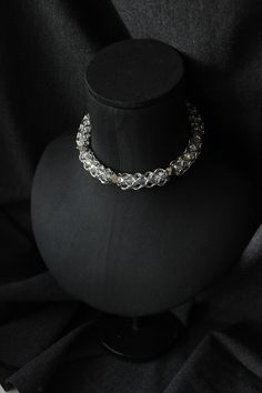 Immerse yourself in the world of unique style with our luxurious choker, meticulously handcrafted. This piece of art is woven from durable steel, exquisite glass beads, pyrite beads . Our choker embodies sophistication and distinctive character, highlighted by its substantial thickness and delicate sparkle. Discover the refinement in every detail of this accessory that adds incomparable charm to your look. Total length of the choker (adjustable) 47 cm / 18.5 inch **PACKAGING** All jewelry comes Handmade Silver Gothic Choker, Gothic Chainmail Metal Jewelry, Unique Metal Choker With Adjustable Chain, Handmade Gothic Choker Jewelry, Gothic Chainmail Jewelry Gift, Festival Metal Jewelry Wire Wrapped, Wire Wrapped Metal Jewelry For Festival, Silver Chain Choker For Festivals, Silver Medieval Jewelry For Festivals