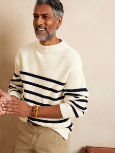 A modern take on the traditional fisherman's sweater, this mock-neck design is truly inspired with classic Breton stripes and luxurious ribbed texture.  Ours is crafted from 100% organic cotton and cut with side slits and a dropped shoulder for comfo Europe Clothes, Breton Stripes, Striped Knitted Sweater, Tie Sweater, Fisherman Sweater, Fashion Project, Ribbed Texture, Men's Knit, Sweaters And Jeans