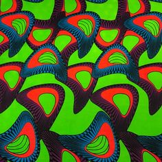 an abstract painting with red and blue shapes on green background, which is very similar to the pattern used in african art