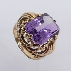 Item Description:- A fine Vintage 9 carat gold Amethyst ( app .7ct) Ring assayed for London 1955.  It comes in the Plush lined presentation  box shown. Size:-  UK Size N - band 3 mm wide, face 18.2 mm wide.  US size 6 1/2. 6.2 grams.   Condition:- In good condition.   Item Number:-  6948 - 022/1675 Cromwells  Antique Centre is open from 10am - 5pm 7 days a week! For any questions or queries please telephone or email us -  Tracy Large Cromwells Antique Centre The Maltings, Station road Sawbridgew Art Deco Amethyst Ring In Yellow Gold, Yellow Gold Amethyst Ring In Art Deco Style, Vintage Emerald-cut Amethyst Ring For Anniversary, Vintage Emerald Cut Amethyst Ring For Anniversary, Art Deco Yellow Gold Amethyst Ring, Art Deco Purple Amethyst Ring For Formal Occasions, Purple Amethyst Art Deco Ring For Formal Occasions, Formal Art Deco Purple Amethyst Ring, Purple Amethyst Art Deco Ring