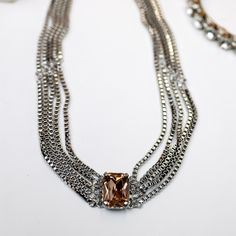 A silver-tone necklace with multiple box-chain strands that meet with a topaz emerald cut crystal. Snow Bunny, Giddy Up Glamour, Snow Bunnies, Silver Necklace Statement, Tennis Necklace, Pretty Stuff, Necklace Statement, Box Chain, Emerald Cut