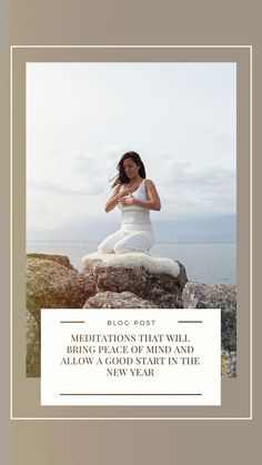 a woman sitting on top of a rock next to the ocean