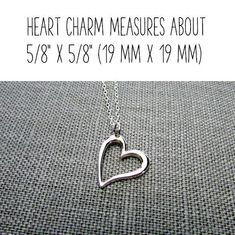 "Silver Heart Necklace | Sterling Silver Heart Charm Necklace | .925 Silver Cutout Heart Jewelry This sterling silver heart charm necklace features a solid, shiny, off-centered 925 silver heart pendant on a solid sterling silver chain. The cutout heart design has a lovely thick 3D design. The heart pendant is hung from one edge on a solid sterling silver chain (choose length at checkout). The silver heart necklace is packaged in a gift tin, ready to give as a Valentine's Day gift or other specia Nickel-free Heart Necklace For Anniversary, Meaningful Heart Pendant Jewelry With Heart Charm, Mother's Day Open Heart Necklace With Charms, Hypoallergenic Sterling Silver Heart Pendant Necklace, Silver Open Heart Charm Necklaces For Valentine's Day, Sterling Silver Open Heart Charm Necklace For Mother's Day, Sterling Silver Heart Charm Necklace, Classic Sterling Silver Charm Necklace For Valentine's Day, Mother's Day Sterling Silver Open Heart Charm Necklace