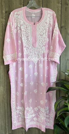 Soft, flowy Chikankari Kurta on modal cotton with fine hand embroidery. Kurta length: 46 inches Pink Embroidered Kaftan In Straight Kurta Style, Traditional Chanderi Kaftan For Summer, White Chikankari Embroidery Kaftan, White Chikankari Embroidered Kaftan, White Kaftan With Chikankari Embroidery, Pink Kaftan With Chikankari Embroidery, Summer Chanderi Kurta With Floral Embroidery, Festive Cotton Traditional Wear With Cutwork, Summer Traditional Wear With Chikankari Embroidery