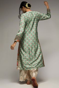 Editor's Note Experience elegance with the tilla green tunic and palazzo set. This pretty ensemble features a floral butta pattern and geometric jaal, delicately enhanced with tiny motifs in silver foil, adding shimmer and richness to the design. The green tunic and palazzo combination exudes grace and style, perfect for special occasions. Embrace the beauty and sophistication of this ensemble and make a memorable fashion statement. Fabric: Tunic: tussar silk, palazzo: cotton, Color: Green Compo Gopi Vaid, Dupatta Embroidery, Sheer Dupatta, Blouse Yoke, Printed Embroidery, Blue Kurta, Flower Mirror, Green Tunic, Palazzo Set