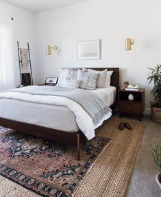 a bedroom with a bed and rug in it