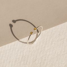 The Tiny Dual Birthstone Ring is our daintier, more petite counterpart of the Dual Birthstone Ring. It's the cutest way to feel connected to your birthstone and commemorate your special bond with another! Material: High-Quality Solid 925 Sterling Silver Stone Dimensions: 2mm Genuine CZ Gemstone Finish: Sterling Silver ∙ 18K Gold ∙ Rose Gold SKU: MM-RM05a Sizing Guide Rings are created true to standard US sizing. For the best fit we suggest having your finger(s) sized. We offer a physical ring si Adjustable White Gold Birthstone Open Ring, Adjustable White Gold Open Birthstone Ring, Adjustable Solitaire Birthstone Ring For Promise, Adjustable Solitaire Birthstone Promise Ring, Adjustable Birthstone Ring For Promise With Open Ring Design, Minimalist Sterling Silver Midi Rings With Birthstone, Adjustable Open Ring Birthstone For Promise, Adjustable Open Birthstone Ring For Promise, Adjustable Birthstone Midi Toe Rings