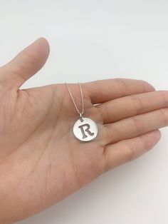 Letter R Pendant made of Solid 925 Sterling Silver ☞ made to last. Matching Ring & Earrings ☞ please ask meDetails:• Letter R Pendant in Silver• Dimensions: Pendant Height 20mm, Width 15mm• Free Complimentary Chain• Solid 925 Sterling SilverSKU PE010490195 Silver Hand Stamped Round Pendant Jewelry, Silver Hand-stamped Round Pendant Jewelry, Sterling Silver Hand Stamped Pendant, Classic Sterling Silver Initials Jewelry, Classic Sterling Silver Jewelry With Initials, Nickel-free Sterling Silver Initial Pendant Jewelry, Sterling Silver Initials Jewelry For Anniversary, Hand Stamped Silver Pendant Jewelry, Sterling Silver Round Pendant For Personalized Gifts