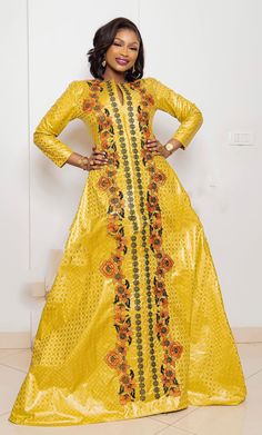 Description: This magnificent custom African dress is perfect for any occasion you want to look your best. It includes 3 pieces (Full dress, wrap-around or Skirt and head-tie).   Important Note: For broderie mix with bazin and garniture mix clothes only: Depending on the availability of the( fabric) / Garnitures (TRIMS) may be different than the one in the pictured. However, the dress will be sewn exactly in the style and colors shown. You can always request to see the fabrics or trims before we Elegant Yellow Kaftan For Festive Occasions, Traditional Long Sleeve Yellow Gown, Yellow Evening Kaftan, Traditional Gold Dresses For Celebration, Yellow Long Sleeve Party Gown, Festive Yellow Party Kaftan, Elegant Long Gold Dress, Elegant Long Sleeve Maxi Dress For Celebration, Traditional Gold Dress For Party