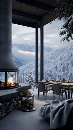 an outdoor fireplace in the middle of a room with chairs and tables on either side