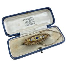 Antique Gold Brooch 15ct Gold Hallmarked Birmingham 1895 Makers Mark L & L Fabulous, Victorian Oval Shaped Brooch. Set with Gorgeous Sapphires & Diamonds. Beautifully Detailed with Fine Etruscan Work, Gold Ball Border & Open Locket Back. Secure Pin & Safety Chain Weight 7.6g Measures Approx Height 16.6mm & Length 48.3mm All of our items are either Antique, Vintage or Preloved. They are in used condition & may show some signs of age related wear, light surface scratches or tarnish. All of our ite Luxury Traditional Brooches With Filigree, Open Locket, Jewelry Wishlist, Gold Brooch, Antique Boxes, Diamond Brooch, Safety Chain, Gold Brooches, Sapphire Diamond