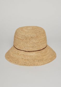 A modern update to the classic bucket hat. Hand crochet by artisans in the finest weave with an adjustable sweatband. We take pride in sourcing quality materials.  Shop Black and Natural/Tobacco Materials: 100% Raffia Measurements: Crown- 4", Brim 3", Head Measurement is 57cm Spot Clean with Damp Cloth Natural Crochet Hat With Curved Brim, Natural Curved Brim Crochet Hat, Brimmed Woven Toquilla Straw Bucket Hat, Woven Toquilla Straw Bucket Hat With Curved Brim, Natural Woven Bucket Hat With Short Brim, Natural Woven Cloche Hat With Short Brim, Natural Woven Short Brim Cloche Hat, Natural Handwoven Bucket Hat With Curved Brim, Natural Toquilla Straw Bucket Hat With Flat Brim