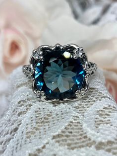 This ring is a reproduction of a sterling silver Victorian filigree antique with a stunning 7ct. natural London Blue Topaz gemstone solitaire. This full cut round gem is 12mm in diameter. The inside of the band is marked 925 for solid sterling silver. Topaz Ring Designs, Victorian Filigree, Victorian Ring, Solitaire Rings, London Blue Topaz Ring, Vintage Wedding Band, Victorian Rings, Victorian Jewelry, London Blue Topaz